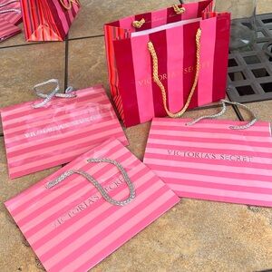 Set of 4 Victoria’s Secret shopping bags.